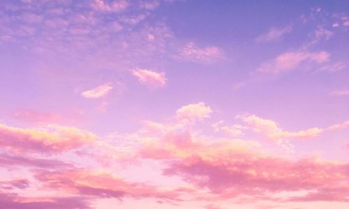 Pink and purple evening sky with clouds Pink and purple clouds in evening sky