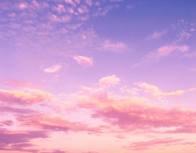 Pink and purple evening sky with clouds Pink and purple clouds in evening sky