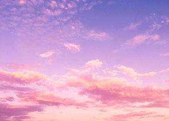 Pink and purple evening sky with clouds Pink and purple clouds in evening sky