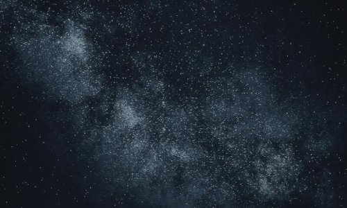 Star-filled night sky over mountains Starry sky with Milky Way over mountains