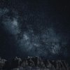Starry sky with Milky Way over mountains