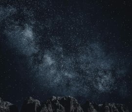 Star-filled night sky over mountains Starry sky with Milky Way over mountains