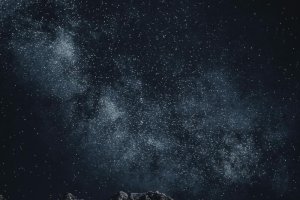 Star-filled night sky over mountains Starry sky with Milky Way over mountains