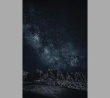 Star-filled night sky over mountains Starry sky with Milky Way over mountains