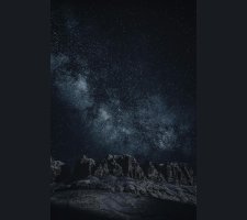 Star-filled night sky over mountains Starry sky with Milky Way over mountains