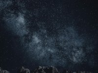 Star-filled night sky over mountains Starry sky with Milky Way over mountains